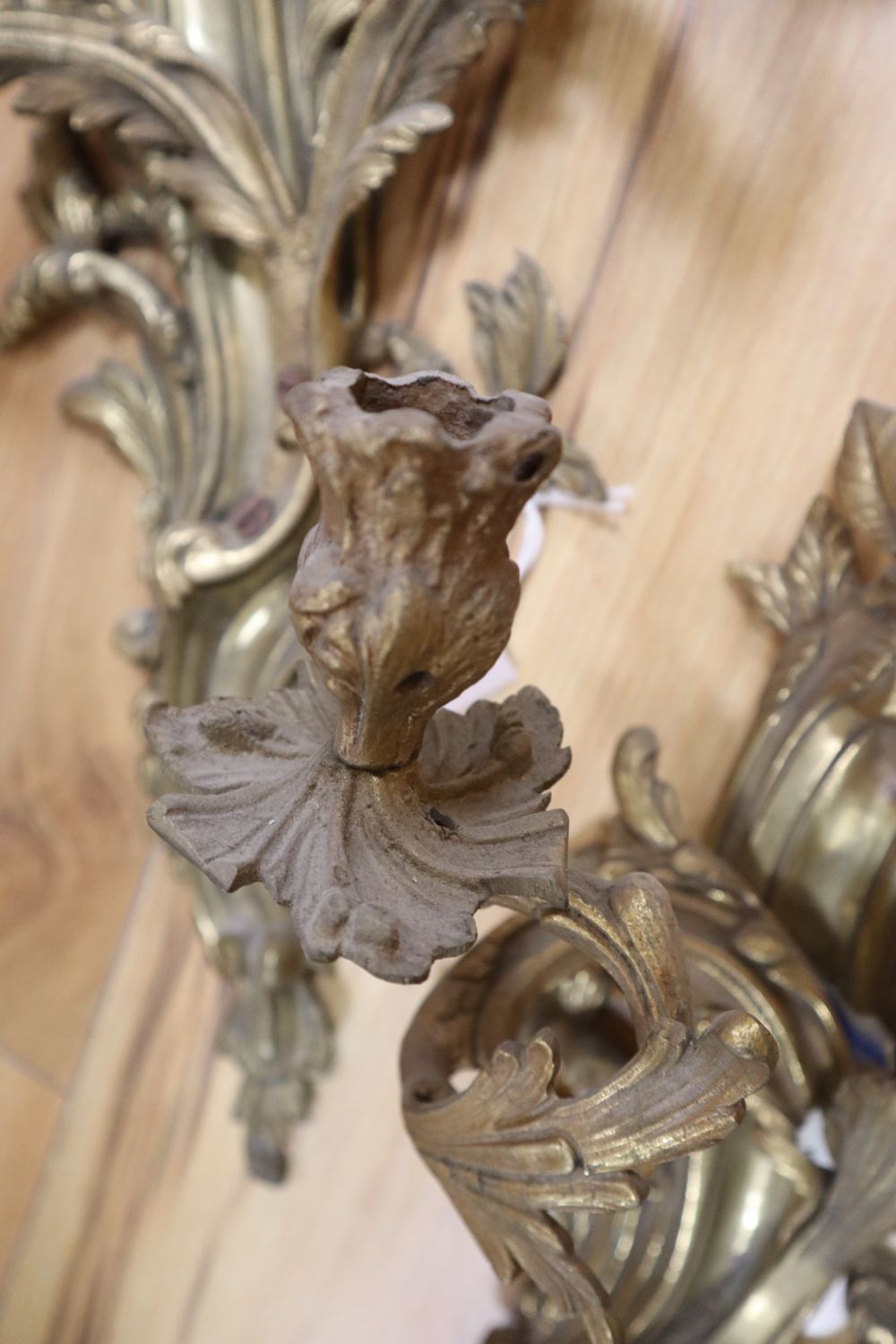 A pair of ormolu scrolled leaf wall sconces, height 54cm